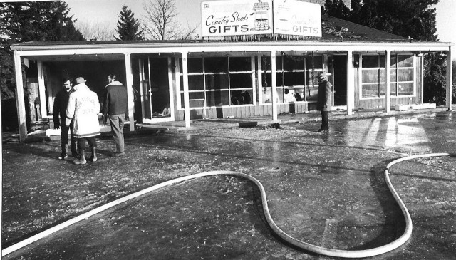 From the Archives: In the Westerly Sun (origknal pics by Bill Burrows) on 12/28/77.  DCFD fought a large fire at the Country Shop Gifts (more commonly known by it's previous name of Kreb's Gift Shop).  This is a shot of the burned out front of the store.